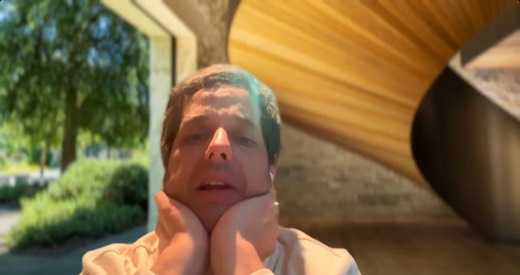Tony Jones webcam, outdoors, hands resting on cheeks