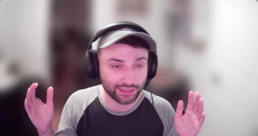 Sebastian Sagastume webcam, close-up, hands raised, talking