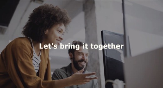 A slide reading "Let's bring it together" over a photo of two colleagues smiling at a computer screen, credited to TLGG Consulting.